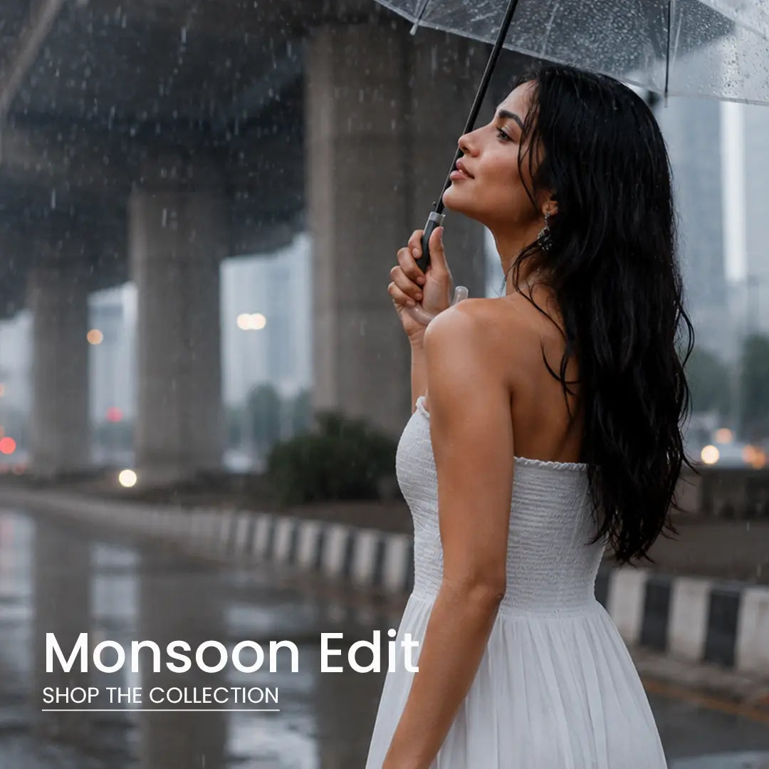 Woman in a white summer dress holding a transparent umbrella during light rain in the city – Cory Edge Monsoon Edit Collection