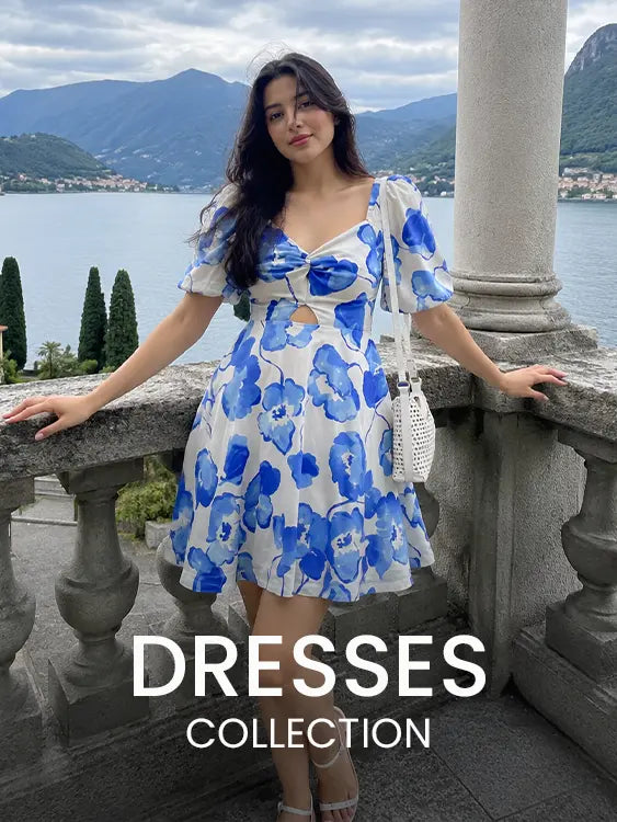 Woman wearing a blue floral mini dress at a scenic lakeside terrace with mountain views – Cory Edge Women's Dresses Collection