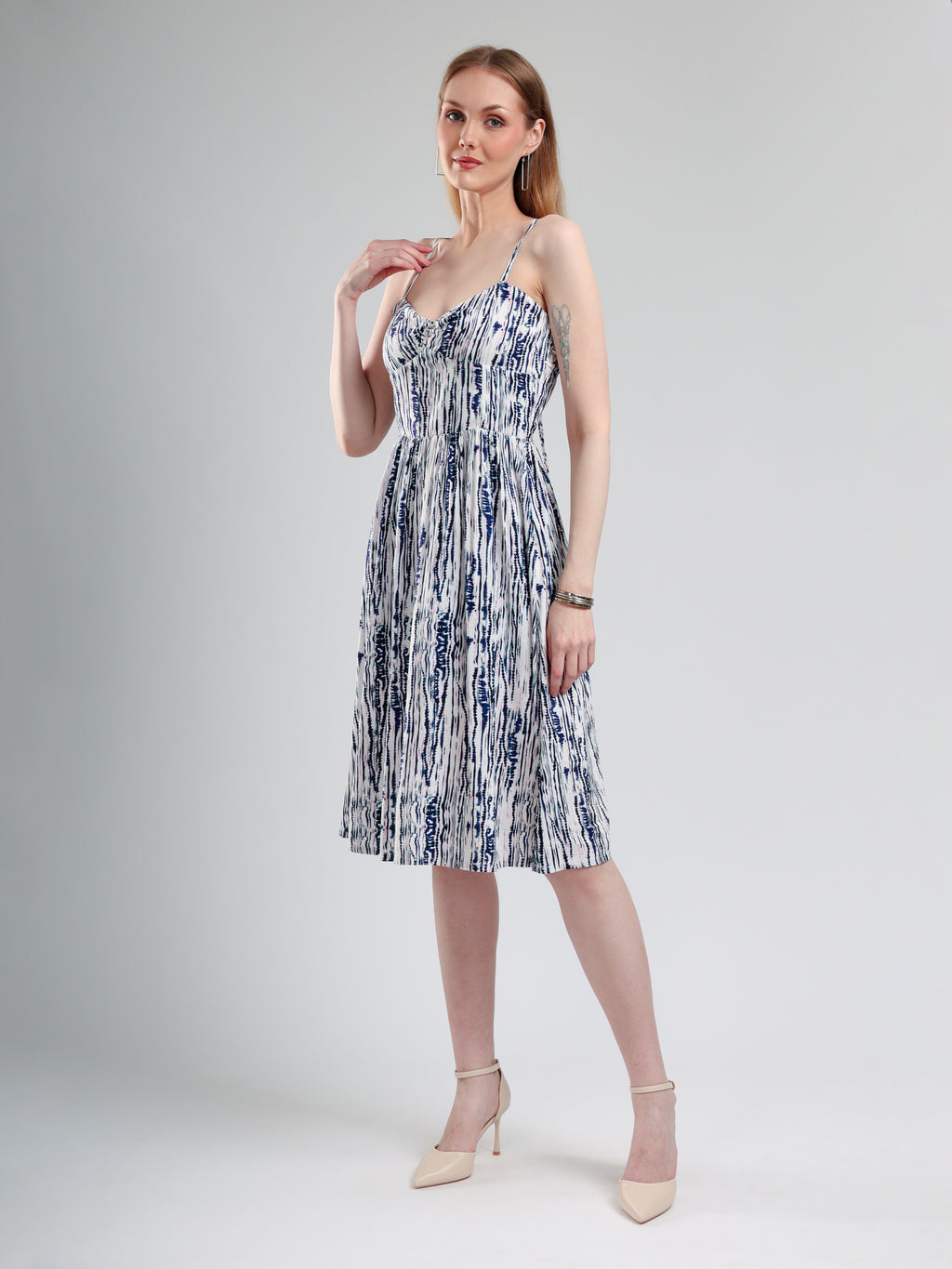 Side pose of blue and white patterned dress for women