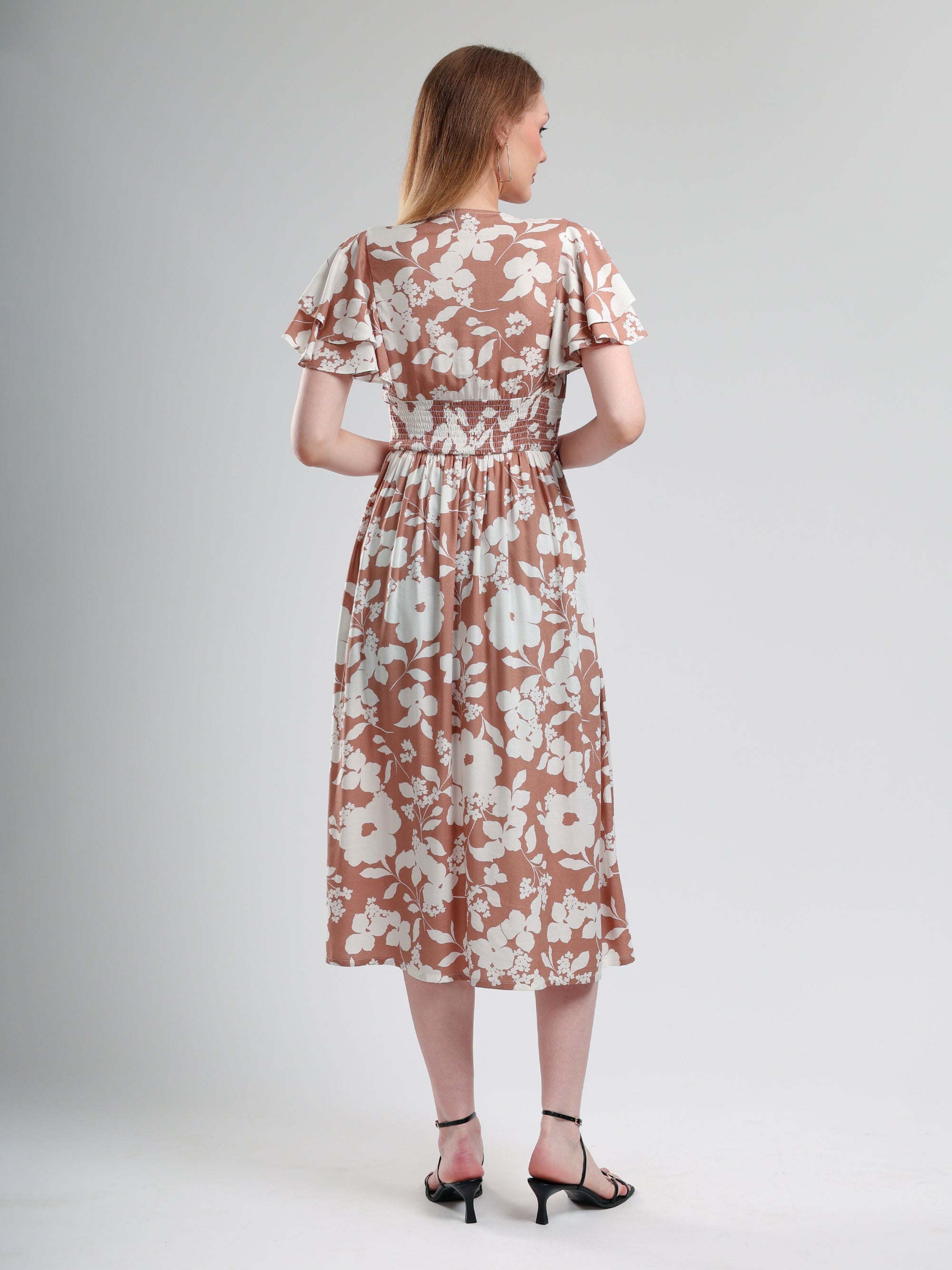 Woman wearing a floral dress  back pose