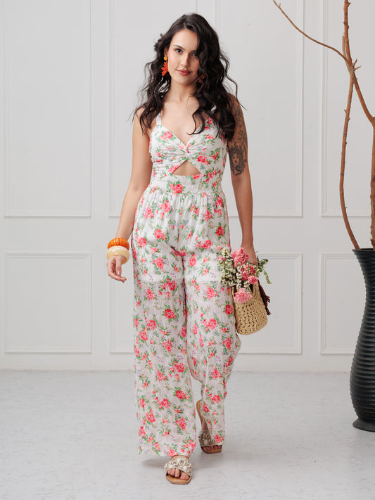 Woman wearing a floral jumpsuit.